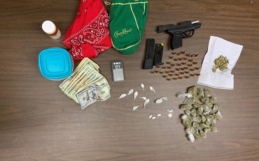 Drugs, a fire arm and other paraphernalia seized in the traffic stop.